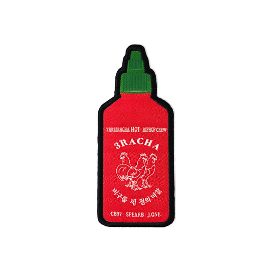 Red bottle-shaped patch with green cap on a white background